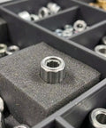 4 Piece Silver Finish One Way Needle Roller Bearings 8mm Bore 14mm Outer Diameter in a storage box.