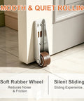 Built Like A Tank Adjustable Vertical Track Rollers For Heavy Duty Gate Smooth Glide Furniture Door Caster Hardware 4 Pack mounted on a door with rubber wheel.