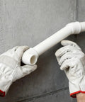 Hands installing 48 Piece 1/2 Inch PVC Pipe Fittings Elbow Set With 3 Way, 4 Way, 45 Degree And 90 Degree Elbows, DIY project setup.