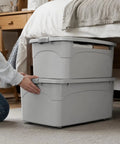 Hassle Free Stackable Storage Bins With Slick Rolling Wheels And Secure Tight Fitting Lids near bed for organizing clothes.