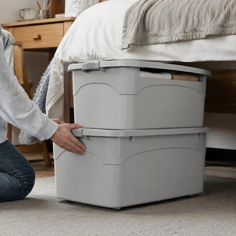 Heavy Duty Stackable Storage Totes With Secure Hinged Lids And Smooth Rolling Casters Plus Reinforced Side Handles For Clutter Free Closet Organization And Dorm Spaces being organized under a bed.