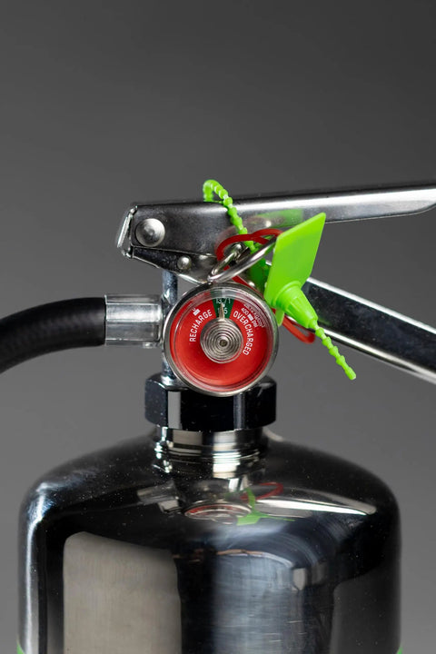 Close-up of a heavy-duty extinguisher nozzle designed to handle runaway lithium blazes with ease to knock out chemical reactions.