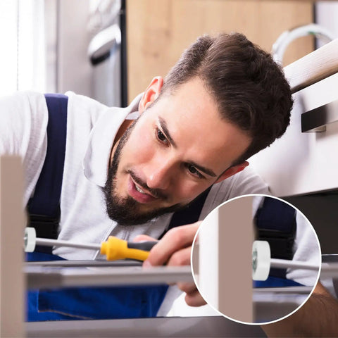 Man installing Straight Up 22mm Nylon Drawer Rollers 4 Pack With Stainless Steel Screws in a kitchen cabinet.