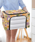 Heavy Duty Foldable Storage Bin With Large Clear Window And Dual Zipper Openings For Quick Grab Access Interior Steel Frame Keeps Structure Intact Festive Pumpkin Ghost Art Collage held in hands, ideal for storage.