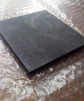 Beefy High Temp Graphite Plate For Pyrolysis Block And Anode, Anti-Corrosion Heat Sink, Tough Hard Graphite, 100x100x35mm on bubble wrap