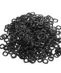 Three Wave Compression Spring Washers Set 500 Pieces In Spring Steel For Screws And Bolts, Heavy Duty Industrial Fastener Kit For Mechanical Assembly, Gaskets And Deflection Friendly Washers. black spring steel three-wave washers in a 500-piece pile