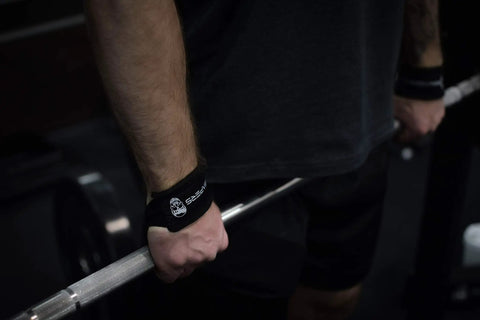 Sick Grip Black Cotton Lifting Wrist Straps Featuring Hella Padded Neoprene Cuffs for Heavy Deadlifts during powerlifting.