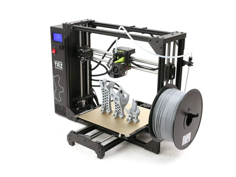 TAZ Workhorse Pro 3D Printer With Premium E3D Hot End And Belt Driven Z Axis For Fast Cycle Times Plus Smart Backlash Compensation, showing printed parts