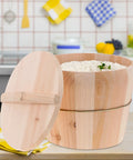 Built Tough Cedar Wood Rice Steamer Bucket With Secure Lid And Heavy Duty Nonslip Base For Uniform Cooking with rice inside.