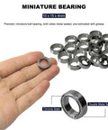 20 Sick Grade 6700 Zz Miniature Ball Bearings Crafted From Solid Chrome Steel With Protective Double Metal Shields For Straight Up Smooth Movement On Heavy Duty Power Tool Rigs Ready To Roll, held in hand with details.