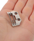 Universal Alloy Needle Plate Model 1-2 For Sewing Machines, Heavy Duty Workhorse Textile And Garment Spare Part With High Traction Feeding And Noise Reduction, Built For Mass Production And Rain Gear Manufacturing, silver metal plate in hand