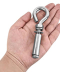 Heavy Duty Expansion Eye Bolts Four Pack With Drill Bit For Concrete Walls Built Tough As Nails Pro Grade Masonry Anchors in hand.