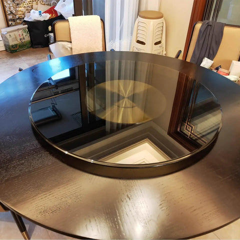 Heavy Duty 39 Inch Round Lazy Susan Turntable For Dining Table Top Hella Smooth Spin 10MM Tempered Safety Glass on dark wooden table.