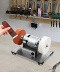 Badass 96W Mini Belt Sander And Bench Grinder With Variable Speed Control For Metal Work And Knife Sharpening compact desktop tool in use.
