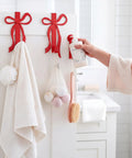 Sort Your Daily Grind Smoothly With These Heavy Duty Red Bow Over The Door Hooks Perfect For Dropping Coats Towels Hats And Bags While Keeping Main Room Coquette Vibes Strong. Image of hooks holding towels and bath items.
