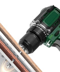 Straight Up Knockout Performance From This 16V Cordless Brushless Power Drill drilling through wood with metal ratchet chuck