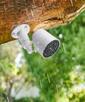 Installed Two Pack Wall Mount Bracket For SimpliSafe Outdoor Security Camera 360 Degree Rotating Holder Under a Rainy Tree