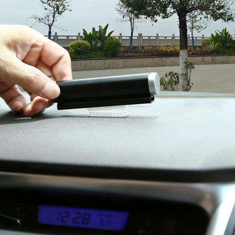 Rock Solid Transponder Mounting Strips For Windshield Toll Tags being applied to a dashboard for secure mounting.