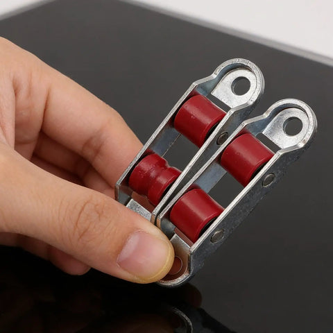 4Pcs Set Rock Solid Steel Slider Door Rollers With Silent Dual Nylon Wheels 16Mm Double Groove Design Self Adjusting Tray shown in hand.