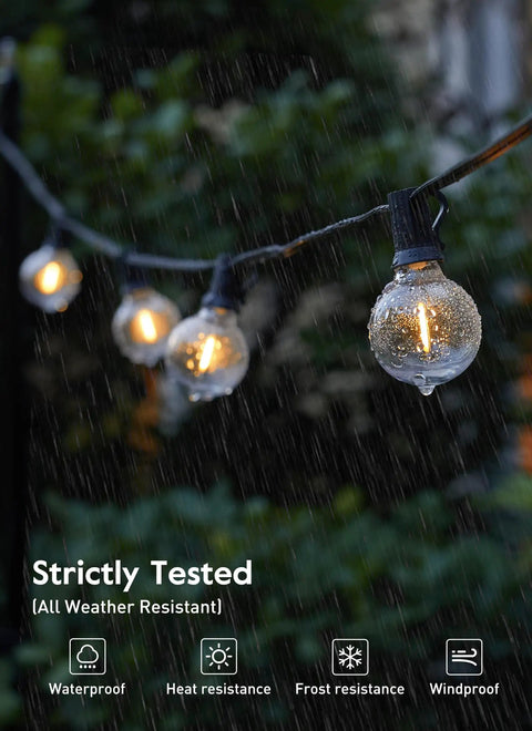 LED Outdoor String Lights 109 Ft With 52 Edison Shatterproof Bulbs Plus 2 Spares in rain, demonstrating weatherproof feature.