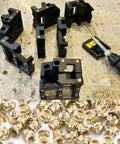 Front view of heat-set insert tools kit with black modular blocks and brass inserts, plus a 60W soldering iron.