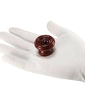 Kick Back Your Cabinet With Rock Solid Wooden Drawer Pulls Single Hole 37X25mm Red Brown Wood Hardware shown on white glove.