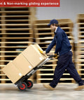 Man pushing a dolly with boxes, featuring 8 Inch Flat Free Solid Rubber Caster Wheel Assemblies For All Terrain Carts And Wagons