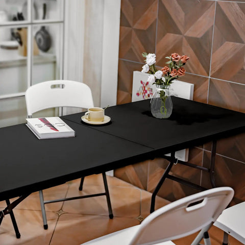 Heavy Duty 6 Foot Folding Table Portable Plastic Fold In Half for Indoor Outdoor Use with Carrying Handle shown in dining setup