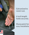 Person installing Beefy 200 Pack Garden Landscape Staples Galvanized 6 Inch Pins Anti Rust 11 Gauge Steel For Weed Barrier Fabric