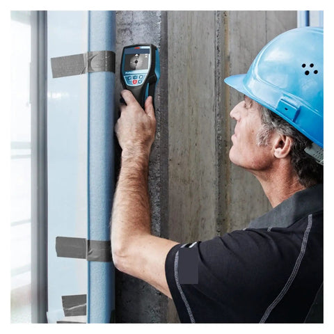 Tough As Nails Stud Finder And Wall Scanner High Precision Metal Detector used by a worker on concrete wall.