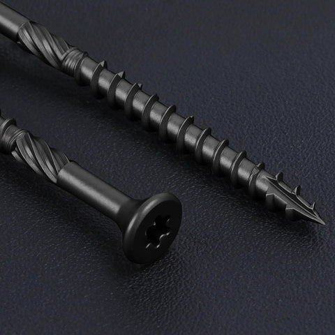 Eight By One And One Quarter Inch Heavy Duty Black Deck Screws Torx Drive With T25 Bit, close-up view on black surface.