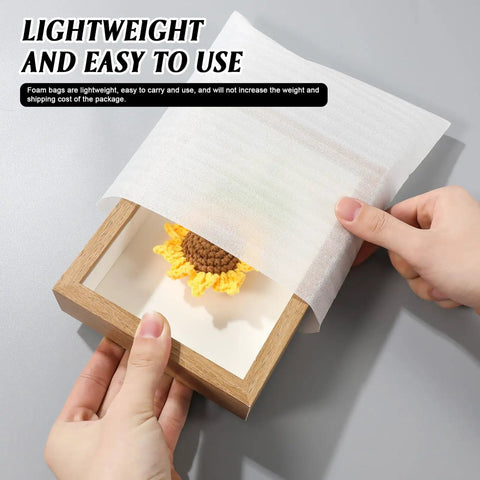 100 Pack Epe Foam Pouches For Shipping Fragile Electronics Hella Cushioned Shock Resistant Packing Bags securely covering a handcrafted sunflower.