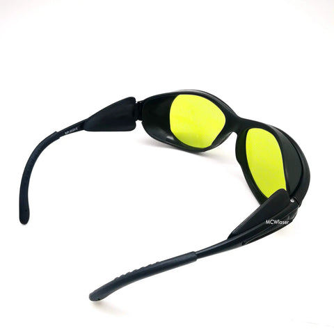 Heavy Duty Laser Safety Goggles Lock Down Eye Protection From UV IR And Blue Light Across 190 To 10600 Nanometers with green lenses and black frame.