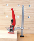 Heavy Duty Ratchet Hold Down Clamp Delivering Dead Nuts Secure Grip On A Twenty Millimeter Base mounted on a wood bench.