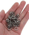 Premium Stainless Steel Spring Lock Washers M6 300 Pack heavy duty anti shake split ring fasteners in a hand.