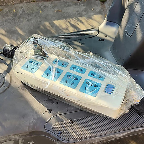 Heavy Duty All Season Road Ready Universal Fit Waterproof EV Charger Cover Shield protecting electrical outlet from rain.