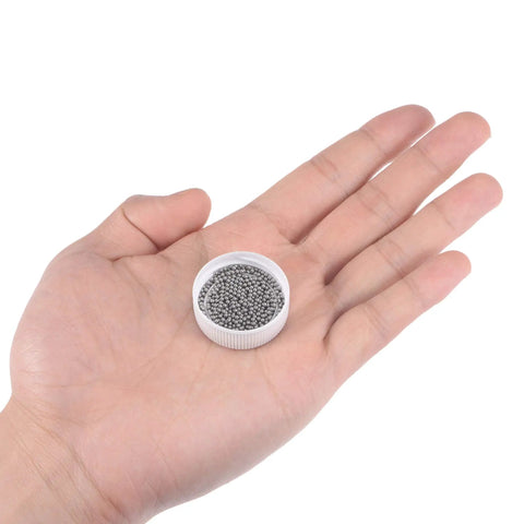 1000 Piece G100 Precision Bearing Balls 1.5mm 304 Stainless Steel shown in hand, ideal for industrial hardware components.