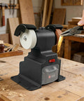 Rock Steady Mini Bench Grinder With 200 Watt Motor And 7000 RPM Spin showing tool sharpening action on workbench.