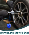 Four Piece Auto Body Dent Puller Kit with manual expansion in use on car tire, showcasing blue portable plastic tabs.