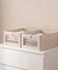 Sleek Foldable Cotton Linen Closet Storage Bins With Clear Window For Clothes Books And Toys Slick Multi Purpose Skinny Containers Easy To Pack Away No Sweat Home Organization Big Time Game Changer 3 Pack displayed on dresser.