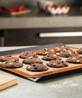Nonstick Silicone Baking Mat For Cookies, Pro Grade Quality With Fiberglass Mesh For Even Heat shown with chocolate cookies