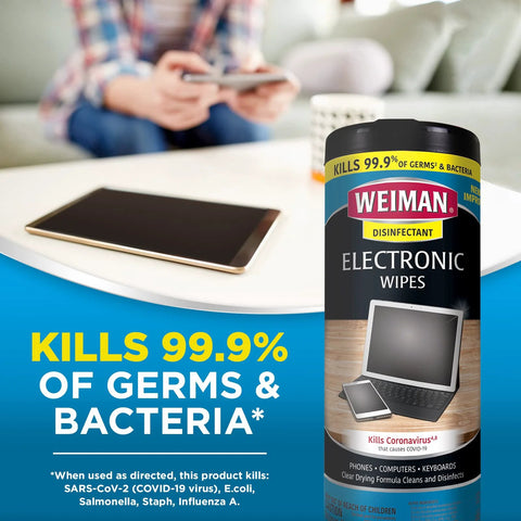 Weiman Electronic Wipes bottle, 30-count, on a table beside a tablet.