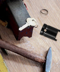 Built Tough Adjustable Clutch Fork Alignment Sleeve Socket Wrench on workbench next to tools and key.