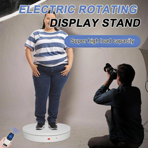 Smooth Operator Heavy Duty Motorized Turntable Remote Controlled Speed Adjustable Rotating Display Platform For Photography And 3D Scanning Handles Up To Five Hundred Pounds In Sleek White with model and photographer