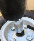 Close-up of a wheel axle with installed Lock Washers Assortment Kit With Internal Tooth Push On Quick Locking Clips Black Fasteners