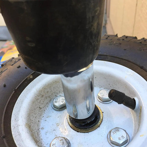Close-up of a wheel axle with installed Lock Washers Assortment Kit With Internal Tooth Push On Quick Locking Clips Black Fasteners