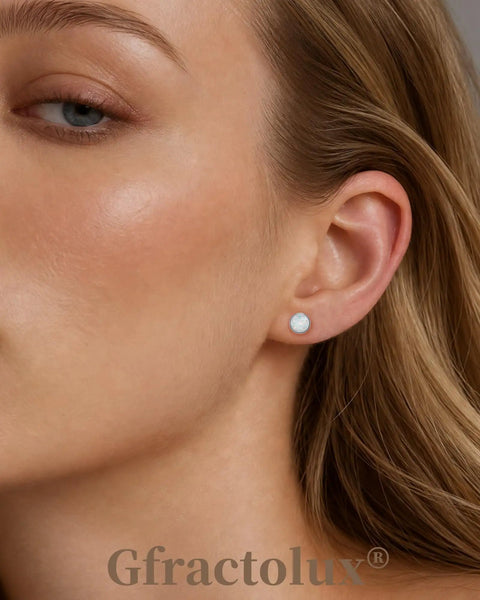 Top Shelf Implant Grade Titanium Opal Stud Earrings Screw Back 5Mm Smooth Gem 20G worn in earlobe on model.