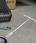 Ergonomic Steering Wheel T Handle Socket Wrench Made From Tough American Steel For Motorcycle Repair on a workshop floor.