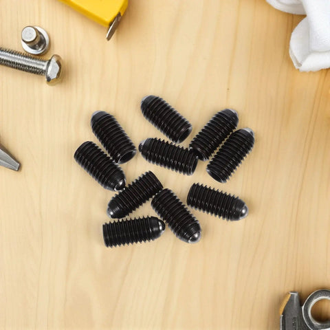 Ten Piece Heavy Duty Carbon Steel Ball Plunger Screws Featuring Internal Hex Quick Setup Design For Lock Tight Bead Positioning And No Fuss Mounting Black Hardware Collection on wooden surface.