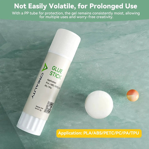Rock Solid 3D Printer Glue Stick For Build Plate Hot Bed Perfect First Layer Adhesive Slaps Down Smooth On Abs Pla Petg Filaments Wipes Clean Easy Release Hella Durable Sticks For Over 100 Prints Pack Of Two on green surface with applicator.
